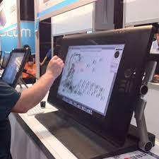 A Drawing Tablet That Is A Self Contained Computer Configurable In Mac Or Pc Setups Shown At The Photoshop World Ev Photoshop World Pc Setup Drawing Tablet