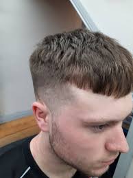 Short Textured Crop With A 0 5 Fade Wall St Barber Shop Facebook