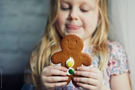 Child Eating Gingerbread Biscuit by Stocksy Contributor Sally Anscombe -  Stocksy