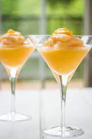 · a frozen peach bellini recipe blended with frozen peaches and peach liqueur then topped with sweet raspberry liqueur and a little tart red wine. Frozen Peach Bellini Recipe With Raspberry Liqueur Cooks With Cocktails
