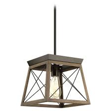 The briarwood collection features a classic pattern inspired by farmhouse or barn doors. Progress Lighting Briarwood Antique Bronze With Faux Painted Wood Pendant Light At Destination Lighting Wood Pendant Light Pendant Light Wood Pendant
