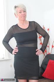 Sexy granny hikes up her dress to expose her shaved pussy in stockings -  Pichunter