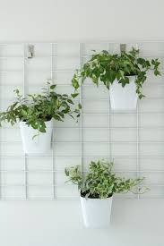 The bright green living wall kit is a collection of small planter cells that you can hang and rehang to create a personalized piece. Diy Living Wall Planter Tutorial Pretty Handy Girl