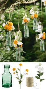 Easy And Low Cost Wedding Decorations Make This Beautiful Hanging Bottle Display Wi Cheap Backyard Wedding Outdoor Wedding Decorations Diy Wedding Decorations