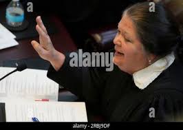 Mississippi Supreme Court Associate Justice Dawn Beam asks a question of  lawyers during their arguments