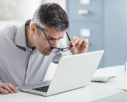 Image of person looking at a computer screen