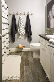 A large bathroom draws attention to the tub with a great globe lamp hanging overhead. Bathroom Renovation Tips 5 Budget Friendly Bathroom Remodel And Decor Ideas