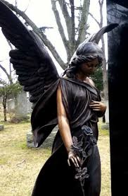 Unique Angel Dressed In Black With A Beautiful Rose In Her Hand Cemetery Angels Angel Statues