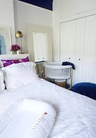 Are we allowed to steal these styles for our own in this baby boy's room, bold orange stripes are a stark contrast to the floor's patterned blue rug. 26 Ideas To Make A Nursery Work In A Master Bedroom Digsdigs