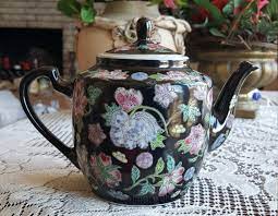 Check spelling or type a new query. 4 Cup Teapot Vintage Chinese Hand Painted Porcelain Teapot Floral Design Raised Multi Flowers Motif On Black Background Luxury Dinnerware Tea Pots Vintage Tea Pots Hand Painted Porcelain