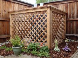 With the addition of the cut flower garden on top, it's pretty and practical. 5 Creative Ways To Cover Your Central Air Unit