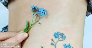 Magic, fascination, secret bonds of love. Forget Me Not Flower Tattoo On The Left Side Of The