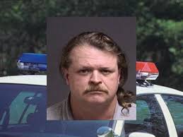 Man charged with stealing from dead man