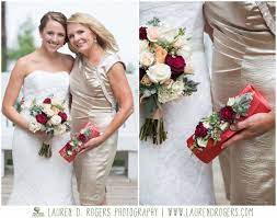 The bridal bouquet is a collection of flowers held by the bride as she walks down the aisle. Corsage Alternative For Mother Of The Bride Floral Purse Flowers On Clutch Wedding Clutch Wedding Mother Of Bride Corsage Bride Mother Of The Bride Flowers
