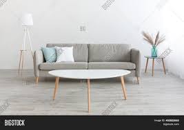 A space painted white and furnishings here and there that complements the area. Minimalist Living Room Image Photo Free Trial Bigstock