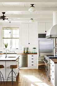 Brass hardware on white kitchen cabinets brings an elegant flair and warm contrast with timeless appeal. 17 White Kitchen Cabinet Ideas Paint Colors And Hardware For White Cabinetry