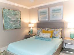 Here there's a little bit of a beach theme to the walls with the sand color but the starfish, flip flop pillows and cute lamp complete the look. Beach House Decorating For En Suite Bedrooms Black Eyed Susan