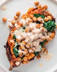 Baked Sweet Potato With Kale And Vegan Tahini Dressing Recipe Vegan Sweet Potato Recipes Sweet Potato Recipes Baked Lunch Recipes Healthy