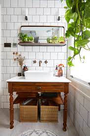Small bathroom vanity with baskets and hooks for storage this tiny room features a small freestanding vanity with very little storage. Bathroom Storage Ideas 29 Sleek Solutions To Tidy Up Your Space Fast Real Homes