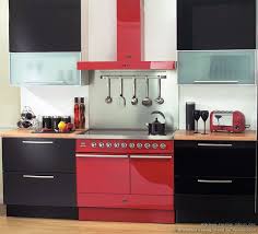 For your black kitchen table, use black and red placemats on it to add a touch of color to the all black kitchen. Kitchen Decor Trends For 2013 Kitchen Decor Trends Black Kitchen Decor Red Kitchen Decor