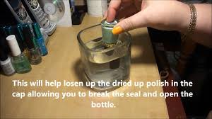 Using hot water, fill the glass just high enough to cover the lid but not high enough to soak the bottle of paint. How To Un Stick A Stuck On Cap On A Bottle Of Nail Polish By Cre8 Youtube