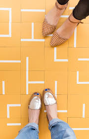 When taping, follow the lines of the original vinyl tiles for easy guidance. Totally Floored How To Create Your Own Diy Floor Tiles On A Budget Without Skimping On Style Paper And Stitch