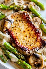 Creamy Pan Seared Pork Chops With Asparagus From The Food Charlatan Creamy Pan Seared Pork Chops Is Such An Easy In 2020 Pan Seared Pork Chops Pork Seared Pork Chops