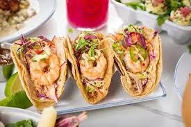 Shrimp tacos, with firm, slightly spicy shrimp on a bed of creamy avocado and tart grapefruit, mixed with tomatoes, topped with shrimp tacos preparation. Shrimp Tacos Citrus Marinated Slow Spicy Aioli Corn Tortillas Jalapenos House Salsa Lime Picture Of The Hampton Social South Barrington Tripadvisor