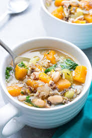 A Hearty Vegetarian And Vegan Soup Made With Wild Rice Butternut Squash Kale And White Beans Vegetarian Crockpot Vegan Crockpot Vegetarian Crockpot Recipes