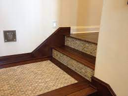 A bench and small side table make the landing look more welcoming. Tile On Stairs Landing Tile Stairs Stair Renovation Stair Landing