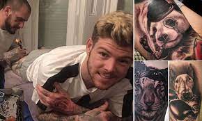 We should point out that the dog depicted wearing boxing gloves in this tattoo is alberto moreno's actual dog. Alberto Moreno Shows Off Bizarre New Animal Tattoos Daily Mail Online