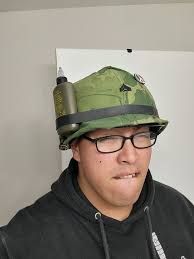 Why is a US Marine wearing a baseball cap under his helmet in the movie  Letters From Iwo Jima?