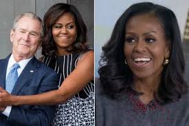 George W. Bush Appears to Slip Michelle Obama Candy at Dad's Funeral