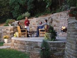 Pavers also work well, but since these are literally made to be used as a wall, they stack nicely. 13 Fire Pit Retaining Wall Ideas Retaining Wall Backyard Landscape Design
