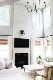 A white wooden fireplace mantel frames blue mosaic surround tiles. Diy Shiplap Fireplace Tutorial Home And Hallow