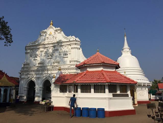 Kande Viharaya hilltop Buddhist temple white stupa seated Buddha Aluthgama Sri Lanka
