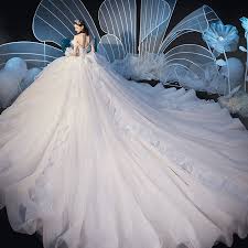 Elegant Champagne Wedding Dresses 2019 Ball Gown Off The Shoulder Feather Short Sleeve Backless Beading Appliques Lace Cathedral Train Ruffle Ball Gown Wedding Dress Puffy Wedding Dresses Princess Wedding Dresses