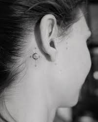 A star tattoo is a broad symbol that can range from simple to complex, a field of stars covering a large space or a single star placed on the wrist and hold countless meanings. What Does A Moon Tattoo Behind The Ear Mean 25 Behind The Ear Tattoos Behind The