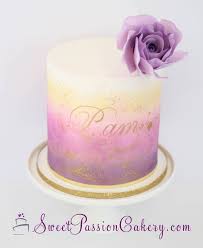 Inspired by a sameen ismail design (originally featured here on the cake blog back in 2013), we love the soft ruffled rosettes paired with the oversized purple flower and small touches of gold. Purple Pink Gold Dusted Cake Sweet Passion Cakery