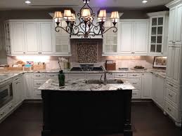 The cabinetry adds to the beauty of the kitchen's interior. Tips And Guidelines For Decorating Above Kitchen Cabinets