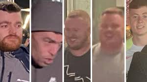 Five charged over holding man down, branding him 'rat'