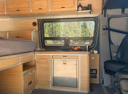 Curved Aluminum And Bamboo Overland Campervan Interior By Zenvanz Van Conversion Kits Campervan Conversions Camper Van Conversion Diy