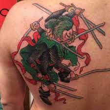 A Beautiful Zoro From The Anime Cartoon Show Onepiece Tattoo By Killabunzz At Dinosaurstudiotattoo Zorotattoo One Custom Tattoo Tattoos Back Tattoo