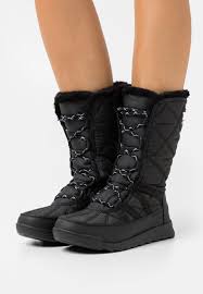 The insulated protection of the sorel® whitney™ tall lace ii boot makes sure you stay comfortable and steady on your feet as you trudge waterproof breathable membrane construction keeps out the wet elements for a drier, more comfortable foot environment. Sorel Whitney Tall Winter Boots Black Zalando Ie