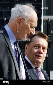 Sir George Young the chief whip (L) and John Hayes MP at No:10 Downing  Street in London, Britain,