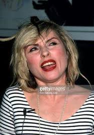 That's my girlfriend Debbie in the black shirt , she ran out of hairspray  this morning .