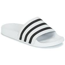 Adidas Originals Adilette Blanc Noir Livraison Gratuite Spartoo Chaussures Claquettes 34 95 Claquettes adilette en caoutchouc bleu et blanc adidas originals avec bout ouvert, semelle intérieure ergonomique et semelle plate en caoutchouc. adilette