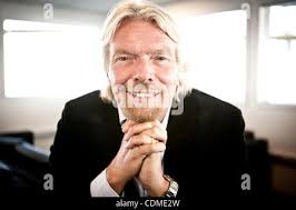 Entrepreneur, Richard Branson, along with Virgin receptionist, Jane  Wilford, celebrate Virgin's sponsorship of an HEMS air ambulance