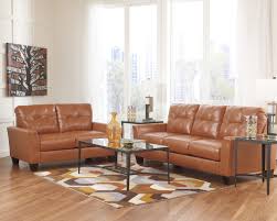 Paulie Durablend Orange Stationary Living Room Group By Benchcraft Orange Furniture Living Room Living Room Orange Living Room Leather