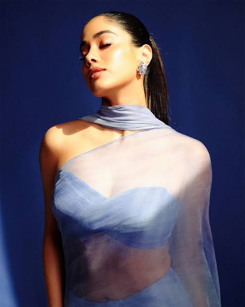 Janhvi Kapoor (@janhvikapoor) in our custom creation — where fluidity  becomes the language of glamour. A blue hand-painted French chiffon fringe  #MMSaree captures the effortless sensuality of the silh
